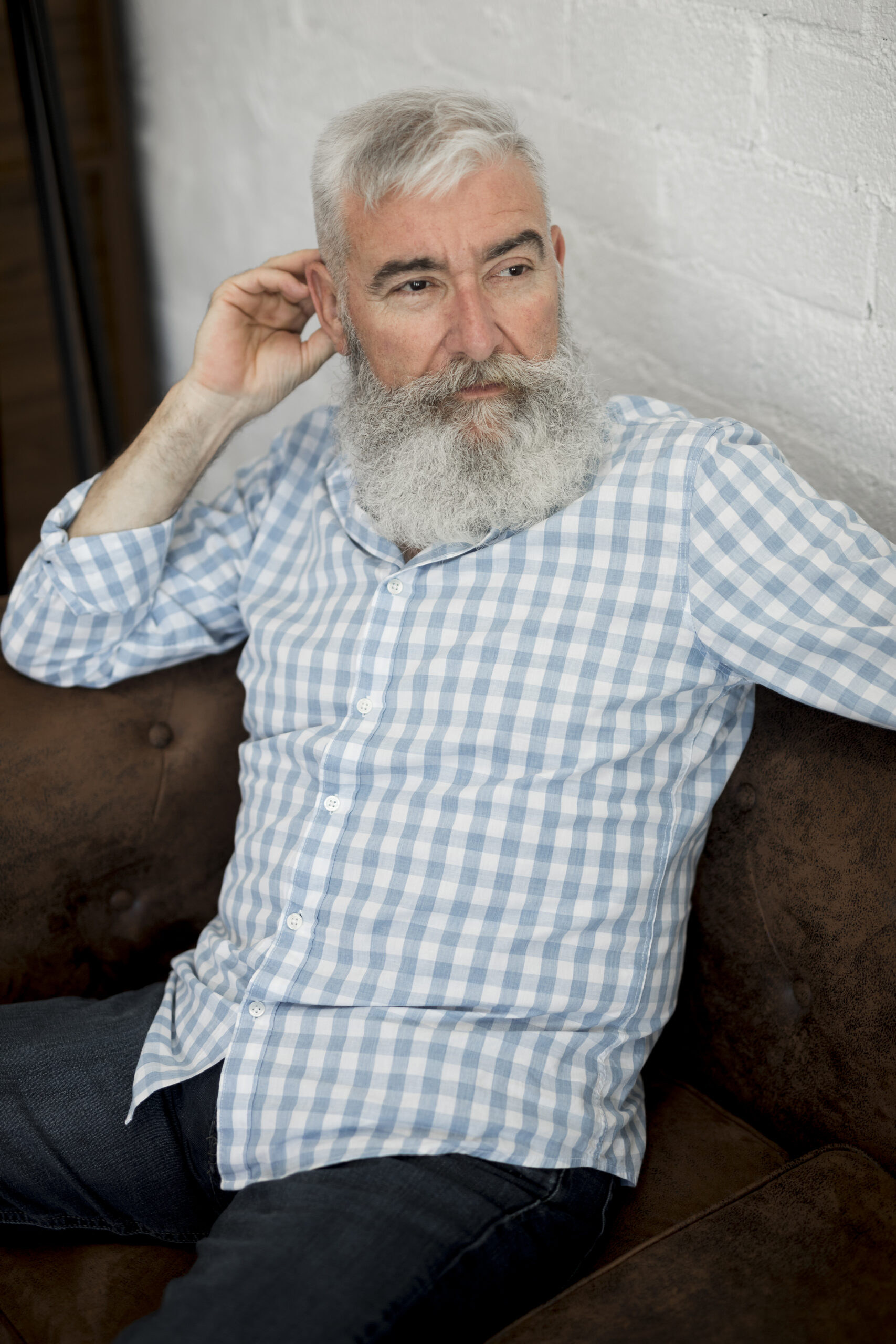 gray haired stylish senior man with long beard