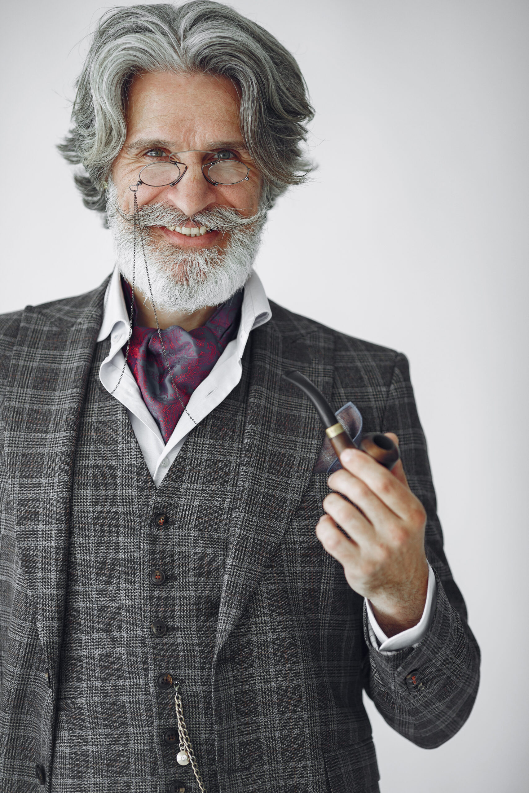 elegant senior man with a smoking pipe